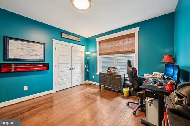 a bed room with a bed and a desk