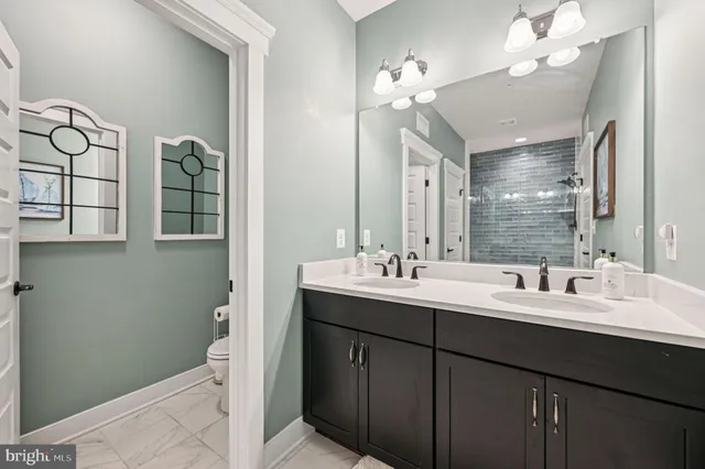 a bedroom with a bed and cabinets