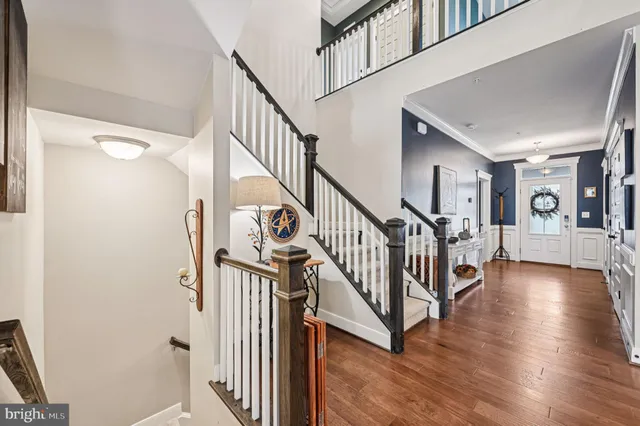 a kitchen with stainless steel appliances kitchen island granite countertop a sink stove and refrigerator