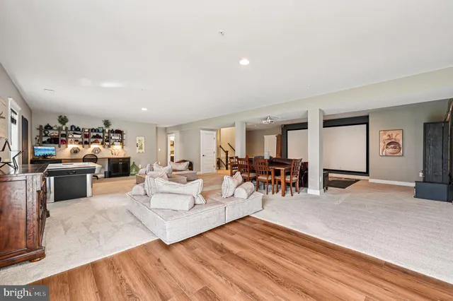 an aerial view of a swimming pool with a table and chairs