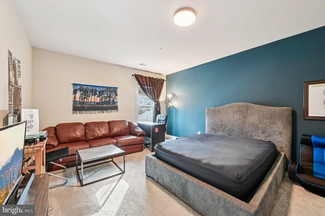 an aerial view of a house with a swimming pool