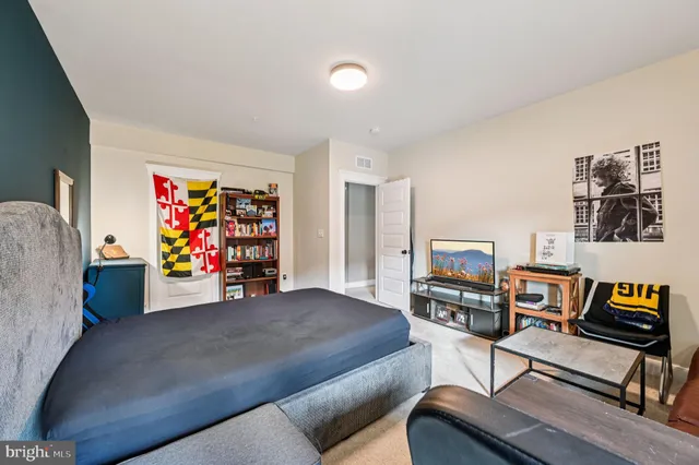 an aerial view of a residential houses with outdoor space and a lake view