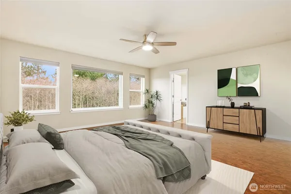 a spacious bedroom with a bed and a dresser