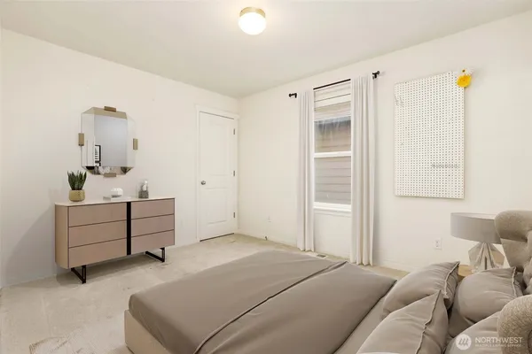 a bed room with a bed and a window