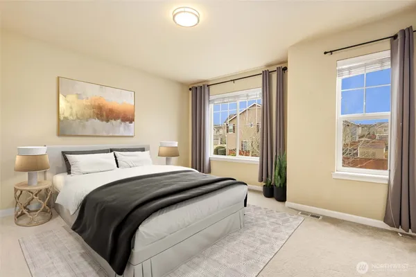 a bedroom with a large bed and a window