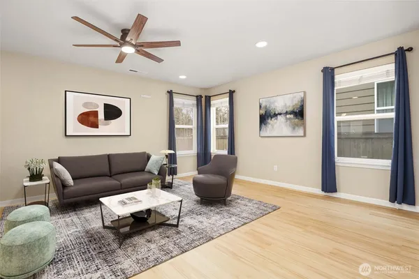 a living room with furniture and windows