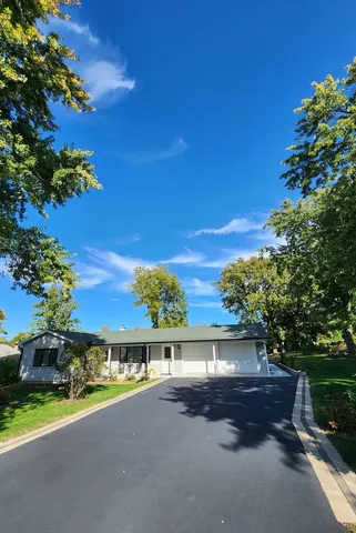 a view of a house with a street