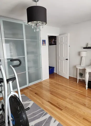 a bedroom with a bed and a television