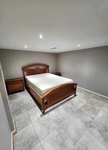 a room with a bed and a cabinets