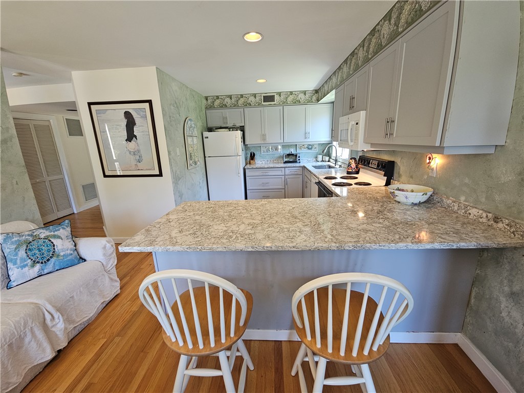 15 Hammersmith Road, Unit 33 Newport, RI 02840 - Photo 13 of 49 Dining area view to Kitchen new granite counters and cabinets view to Hallway to Living Room