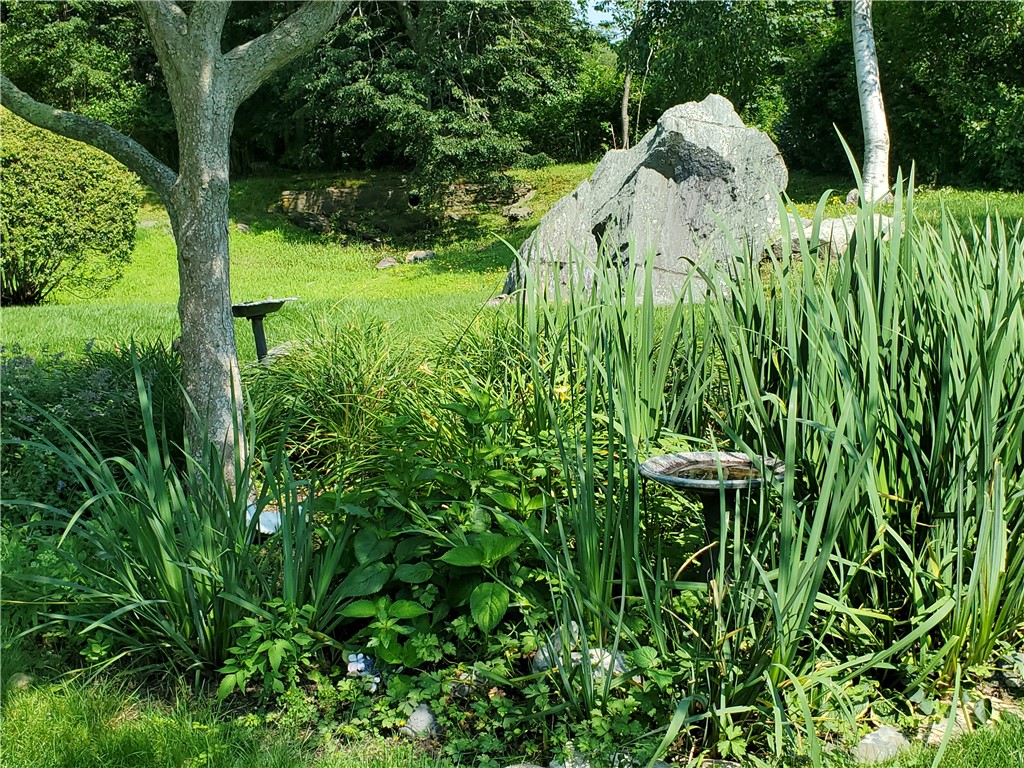15 Hammersmith Road, Unit 33 Newport, RI 02840 - Photo 26 of 49 View from back deck to the back yard garden area