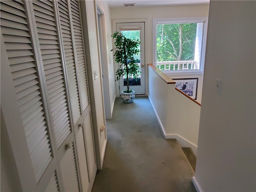 15 Hammersmith Road, Unit 33 Newport, RI 02840 - Photo 38 of 49 Hallway view to 2nd bedroom and front balcony
