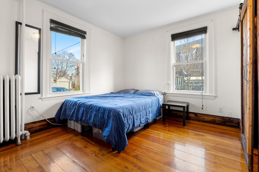 98 Pine Street Swampscott, MA 01907 - Photo 14 of 37 a spacious bedroom with a bed and a window