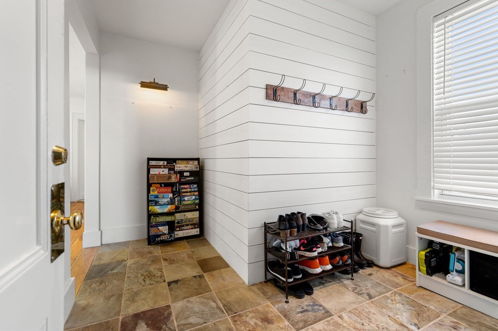 98 Pine Street Swampscott, MA 01907 - Photo 17 of 37 a living room with furniture and a chair