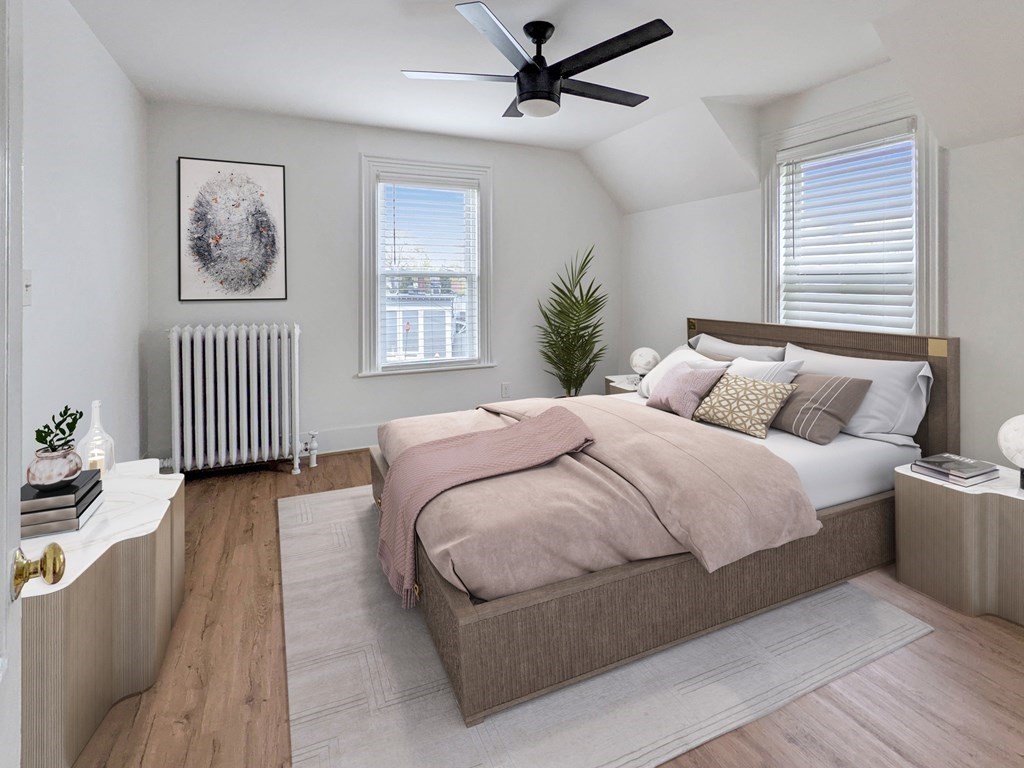 98 Pine Street Swampscott, MA 01907 - Photo 19 of 37 a bedroom with a bed and a chandelier