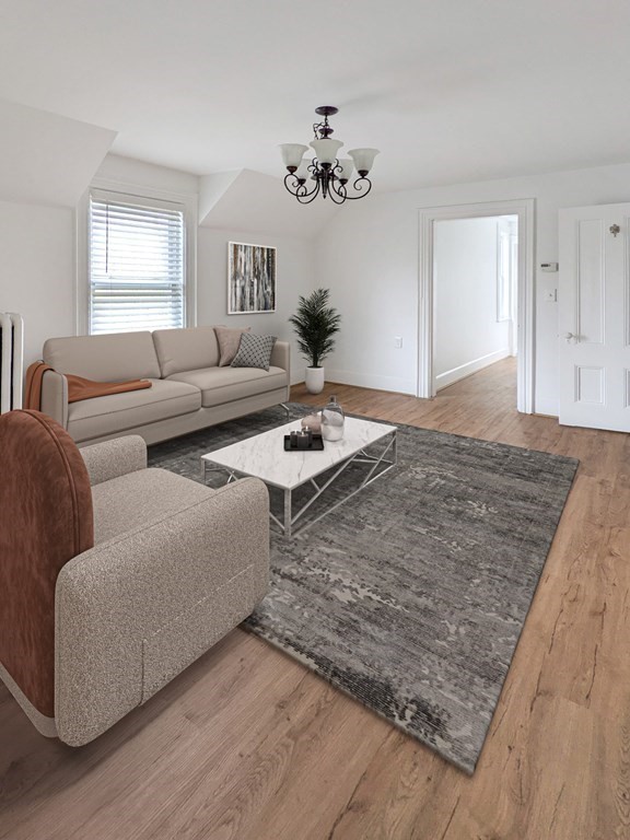 98 Pine Street Swampscott, MA 01907 - Photo 20 of 37 a living room with furniture and a chandelier