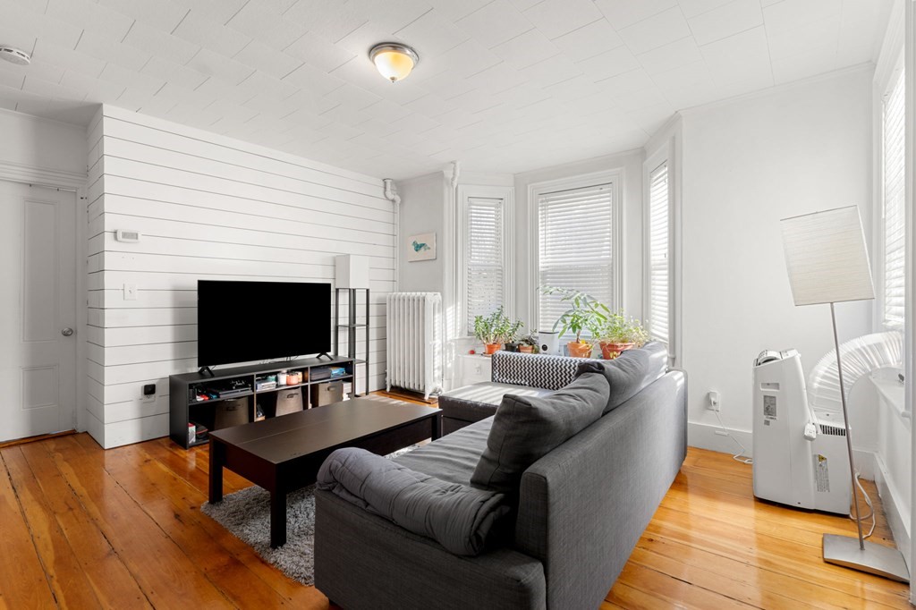 98 Pine Street Swampscott, MA 01907 - Photo 2 of 37 a living room with furniture and a flat screen tv
