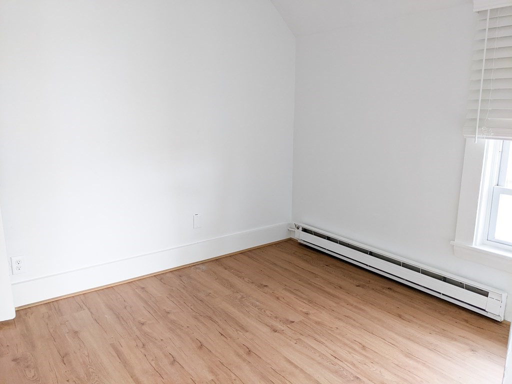 98 Pine Street Swampscott, MA 01907 - Photo 24 of 37 a view of a room with wooden floor and window