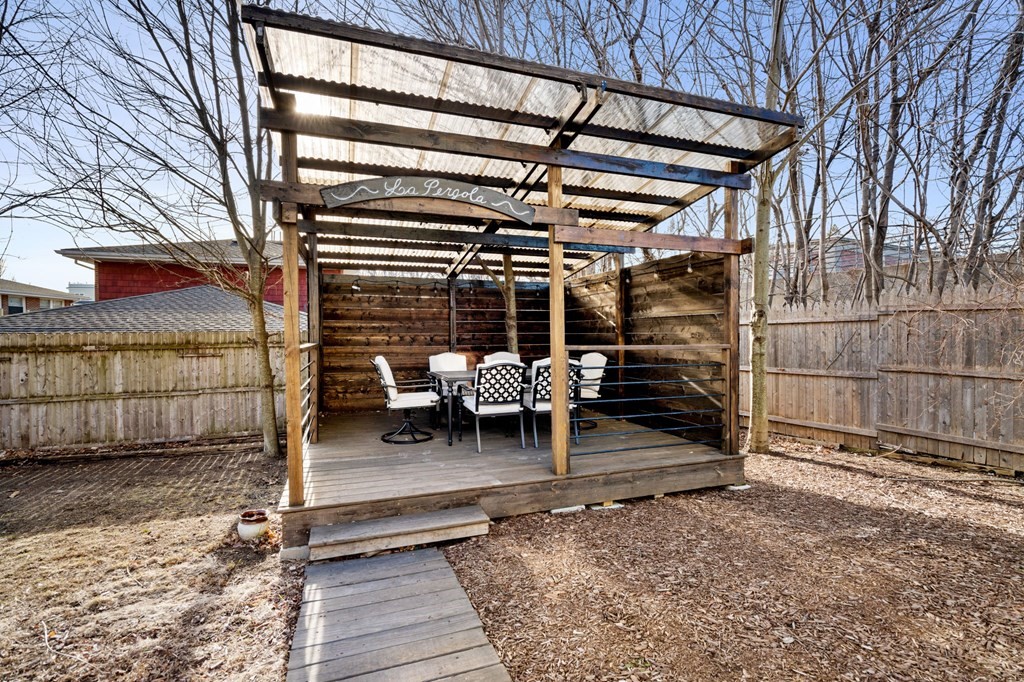 98 Pine Street Swampscott, MA 01907 - Photo 29 of 37 a view of a chairs and table in the back yard of the house
