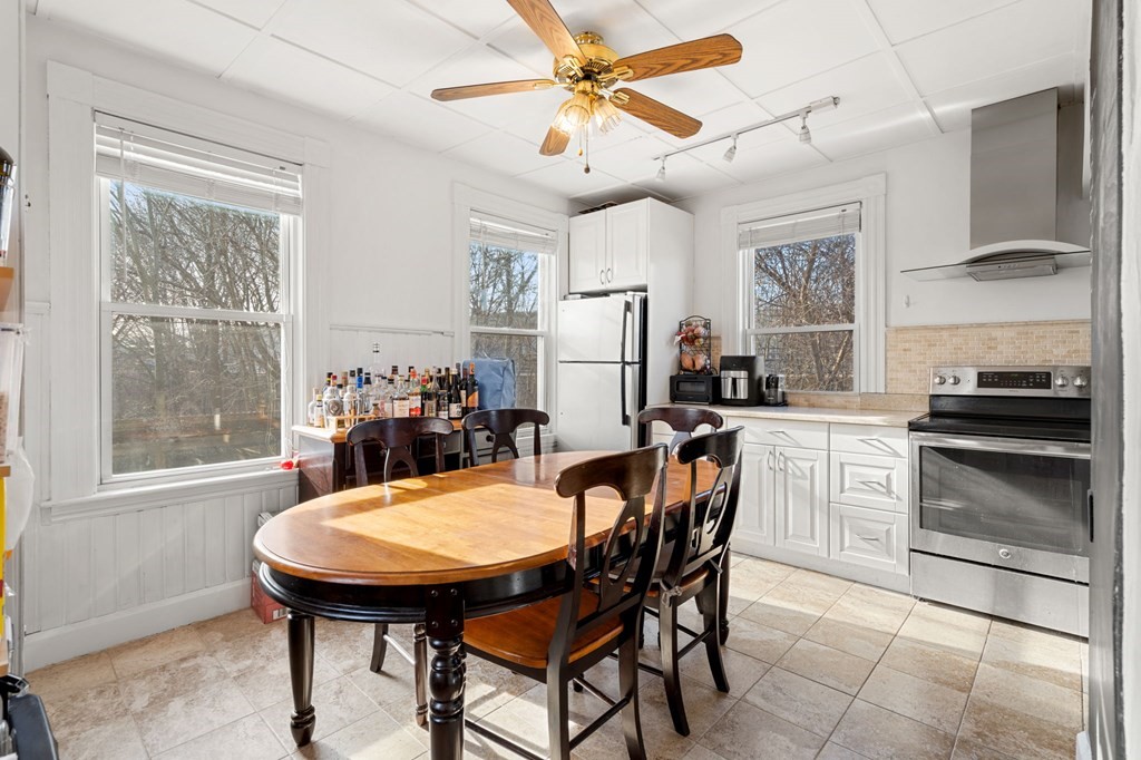 98 Pine Street Swampscott, MA 01907 - Photo 9 of 37 a view of a dining room with furniture and a chandelier fan