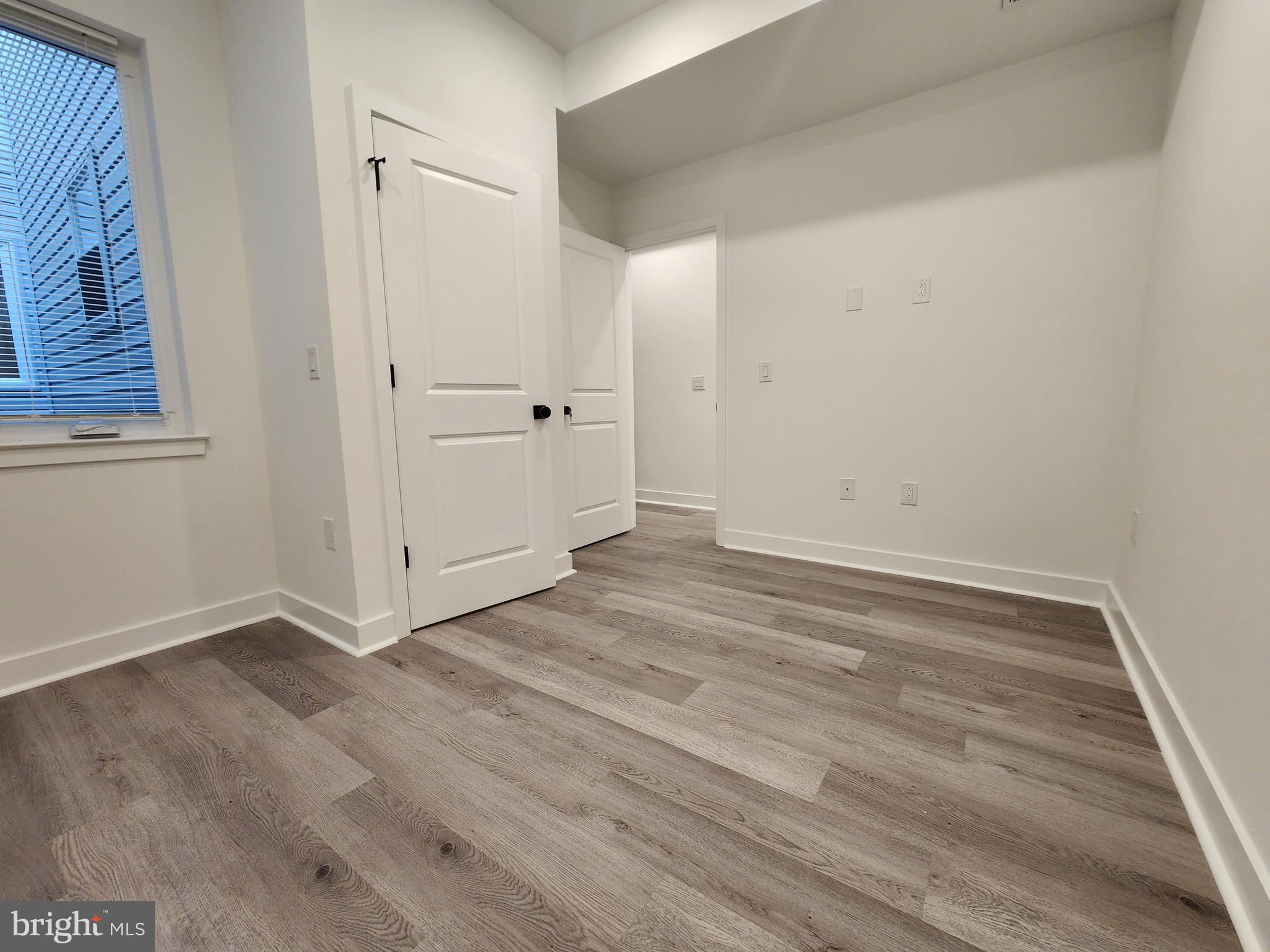 1838 North 17th Street, Unit 2 Philadelphia, PA 19121 - Photo 4 of 8 an empty room with wooden floor