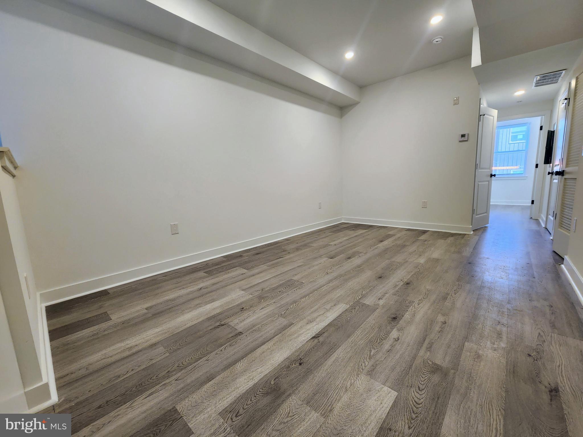 1838 North 17th Street, Unit 2 Philadelphia, PA 19121 - Photo 7 of 8 a view of a room with wooden floor