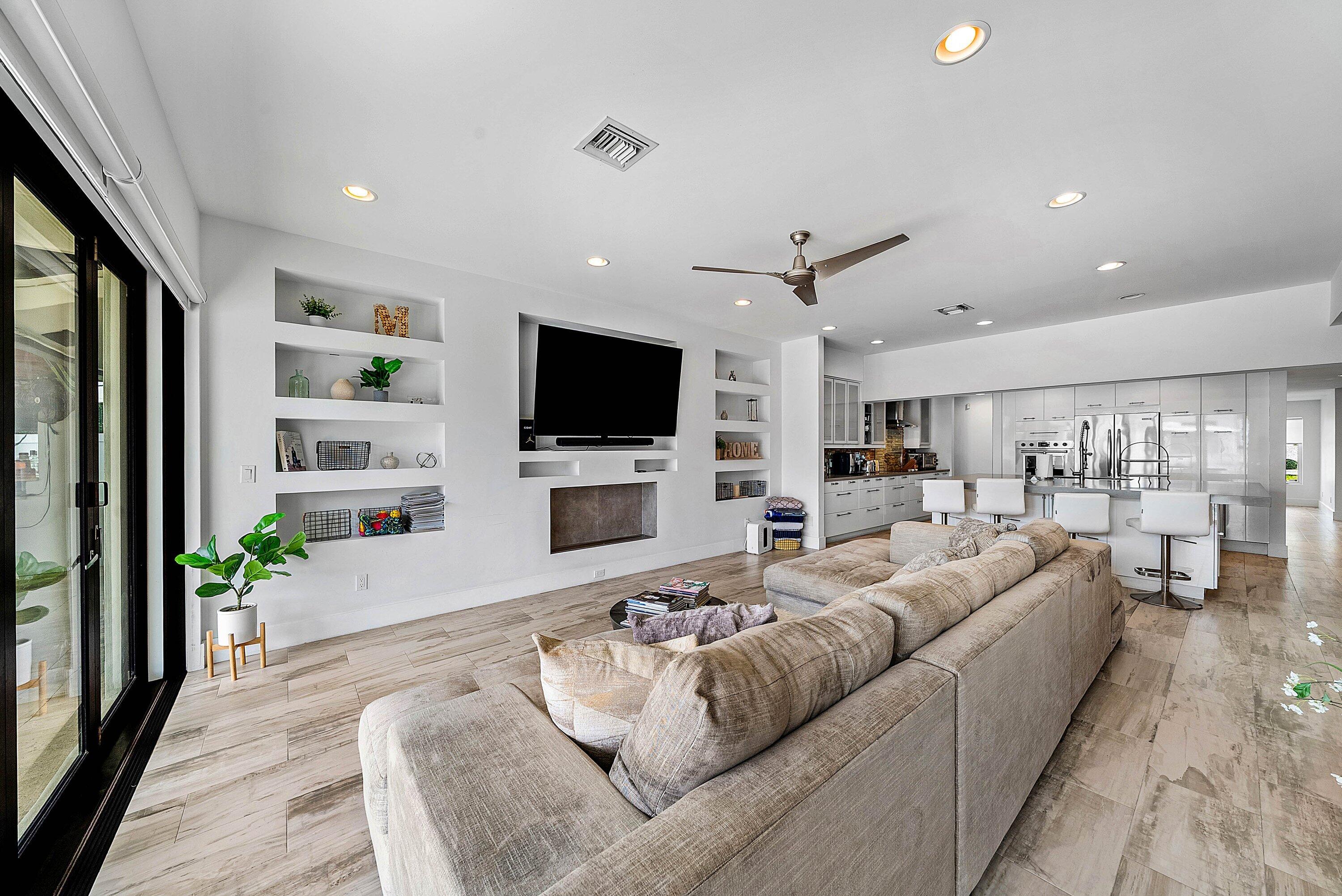 740 Northeast 36th Street Boca Raton, FL 33431 - Photo 16 of 50 a living room with furniture and a flat screen tv