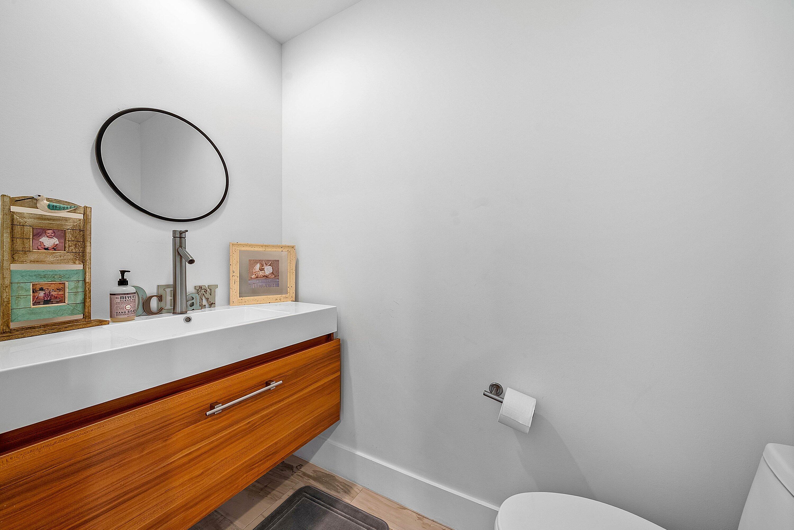 740 Northeast 36th Street Boca Raton, FL 33431 - Photo 6 of 50 a bathroom with a toilet mirror vanity and a sink