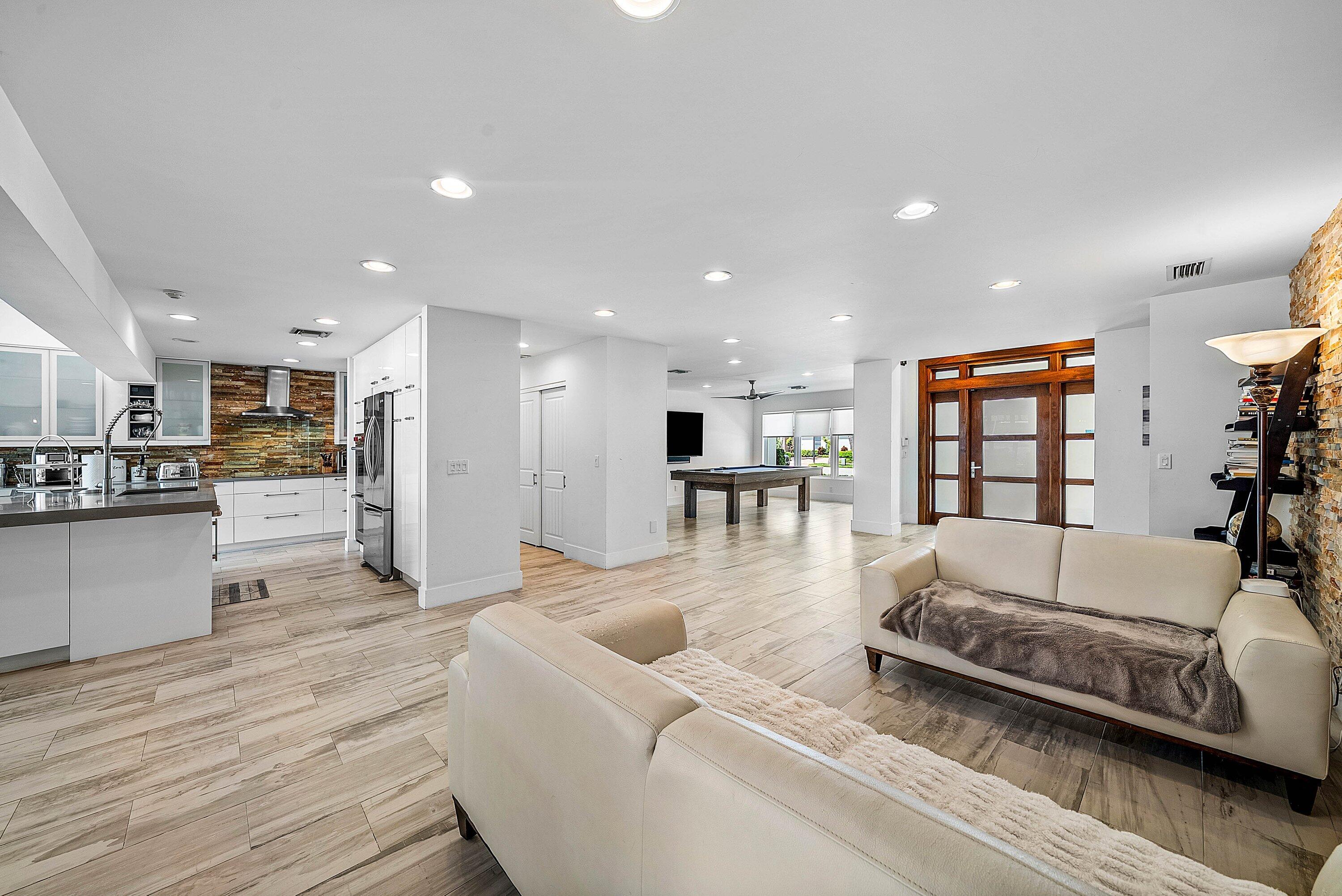 740 Northeast 36th Street Boca Raton, FL 33431 - Photo 8 of 50 a large living room with stainless steel appliances granite countertop a couch and a view of living room