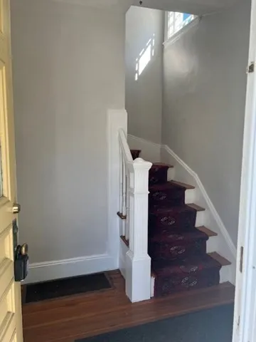 a view of entryway with wooden floor