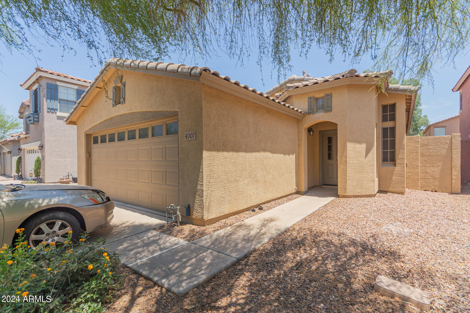 4007 East Ironhorse Road Gilbert, AZ 85297 - Photo 3 of 33 a front view of a house with garden