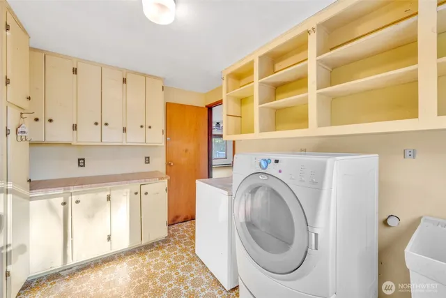 a utility room with dryer and washer