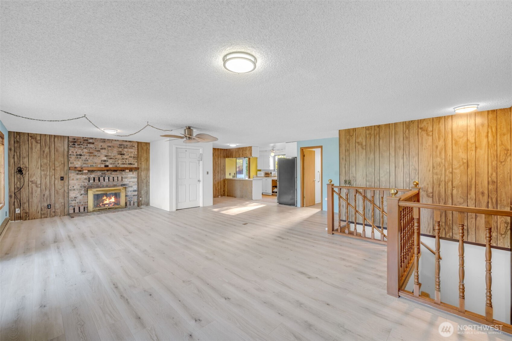 10318 Morris Boulevard Steilacoom, WA 98388 - Photo 17 of 38 an empty room with wooden floor and windows