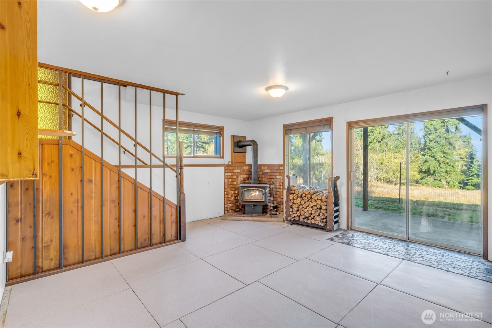 10318 Morris Boulevard Steilacoom, WA 98388 - Photo 19 of 38 a living room with furniture and large windows