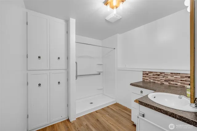 a bathroom with a sink and a mirror