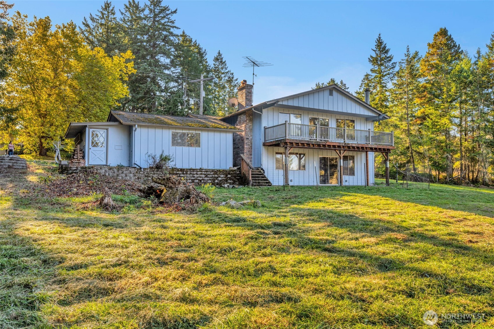 10318 Morris Boulevard Steilacoom, WA 98388 - Photo 25 of 38 a front view of house with yard and trees in the background