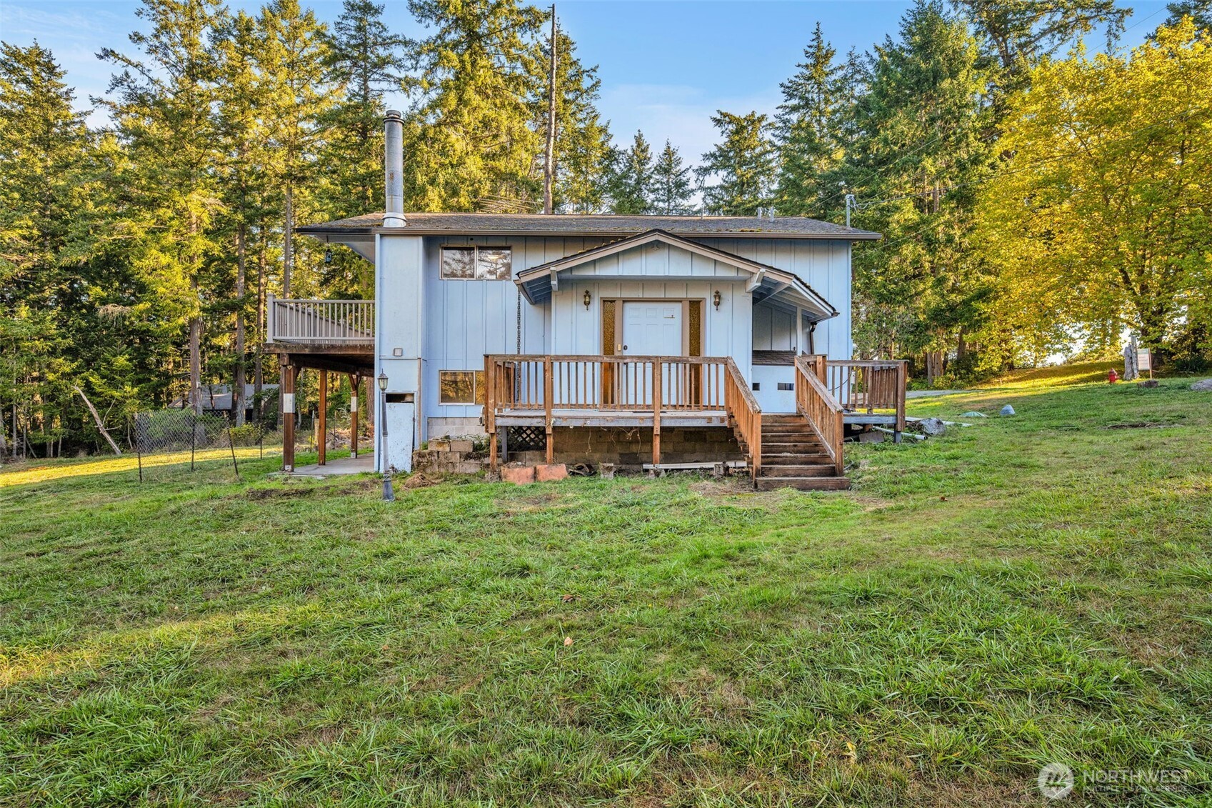 10318 Morris Boulevard Steilacoom, WA 98388 - Photo 27 of 38 a front view of a house with a yard table and chairs