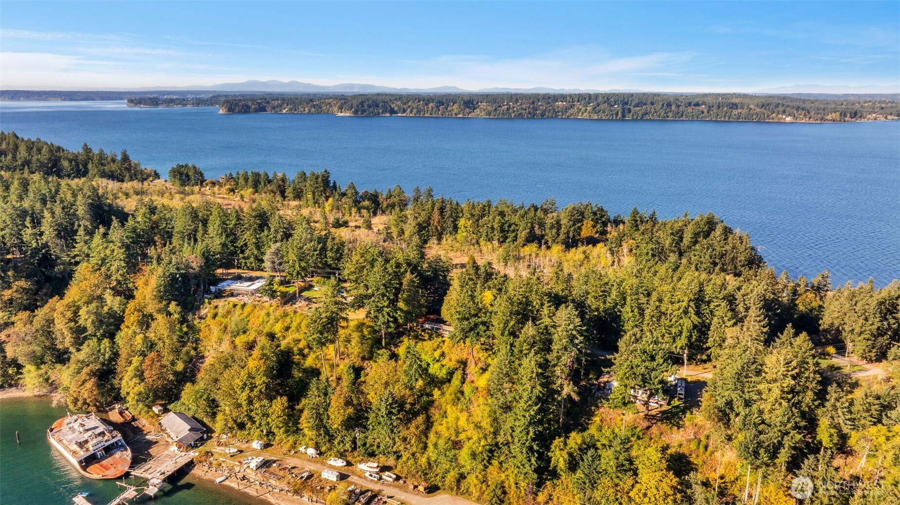 10318 Morris Boulevard Steilacoom, WA 98388 - Photo 32 of 38 a view of a lake and trees in the background