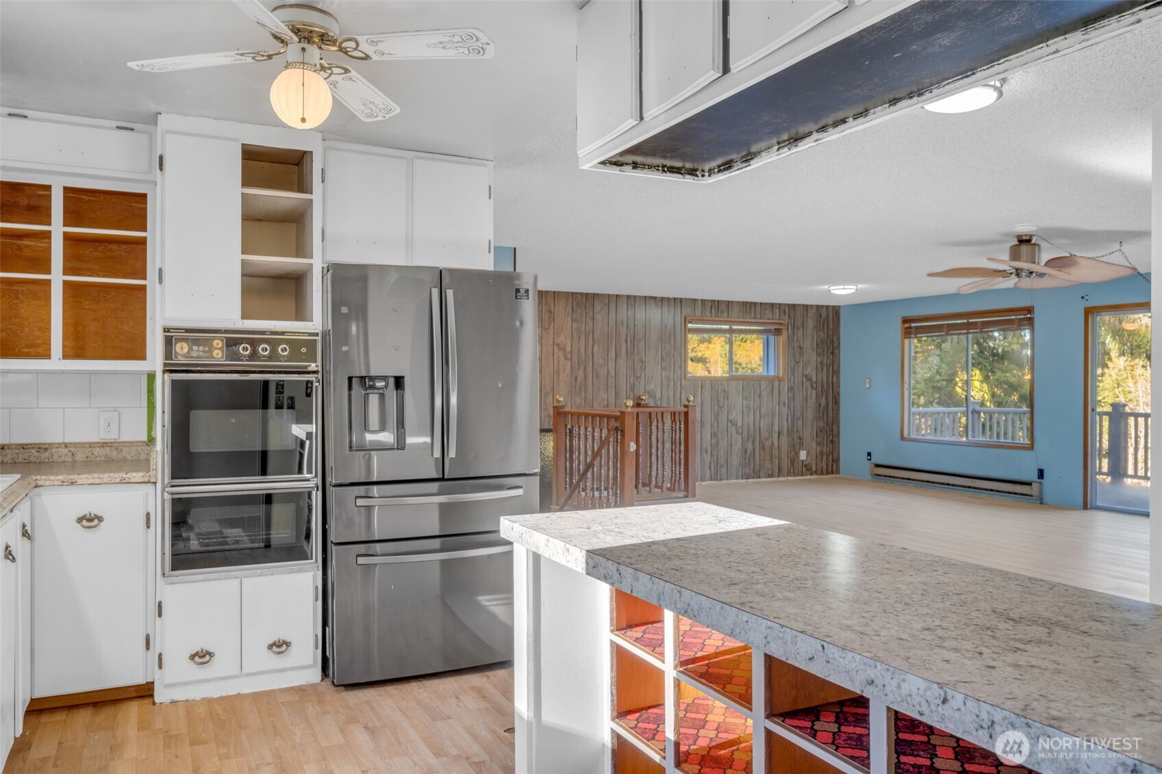 10318 Morris Boulevard Steilacoom, WA 98388 - Photo 6 of 38 a kitchen with stainless steel appliances granite countertop a sink and a refrigerator