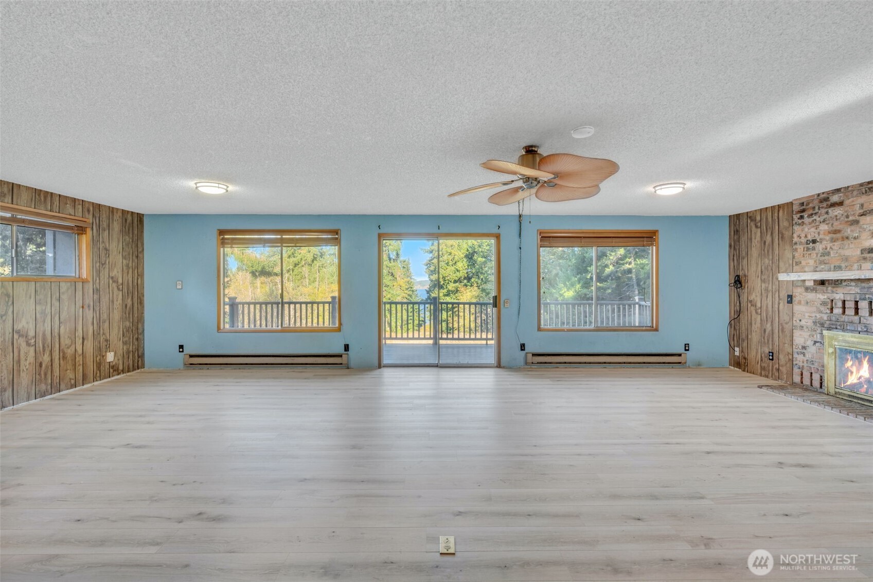 10318 Morris Boulevard Steilacoom, WA 98388 - Photo 10 of 38 wooden floor in an empty room with a window