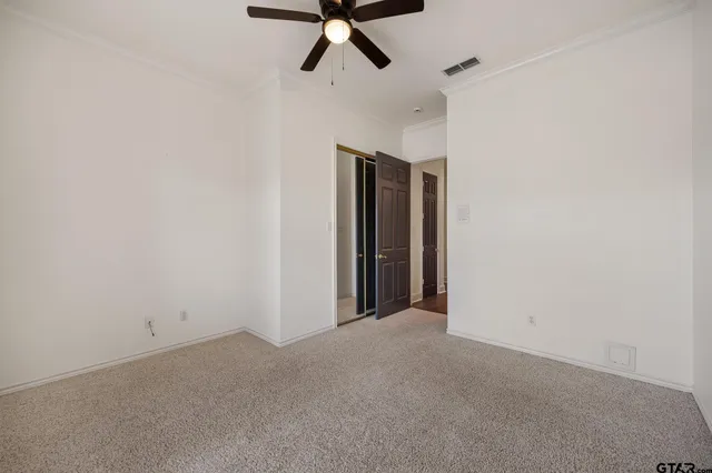 a bathroom with a sink a toilet a shower and a mirror