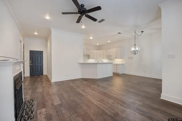 a view of a kitchen with a sink and a refrigerator