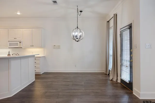 a view of cabinets and window