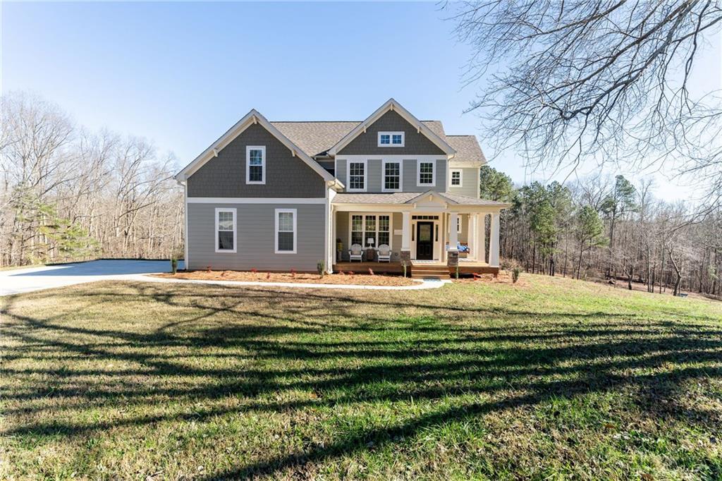 3750 Johnston Road Winston, GA 30187 - Photo 1 of 1 a front view of a house with a garden