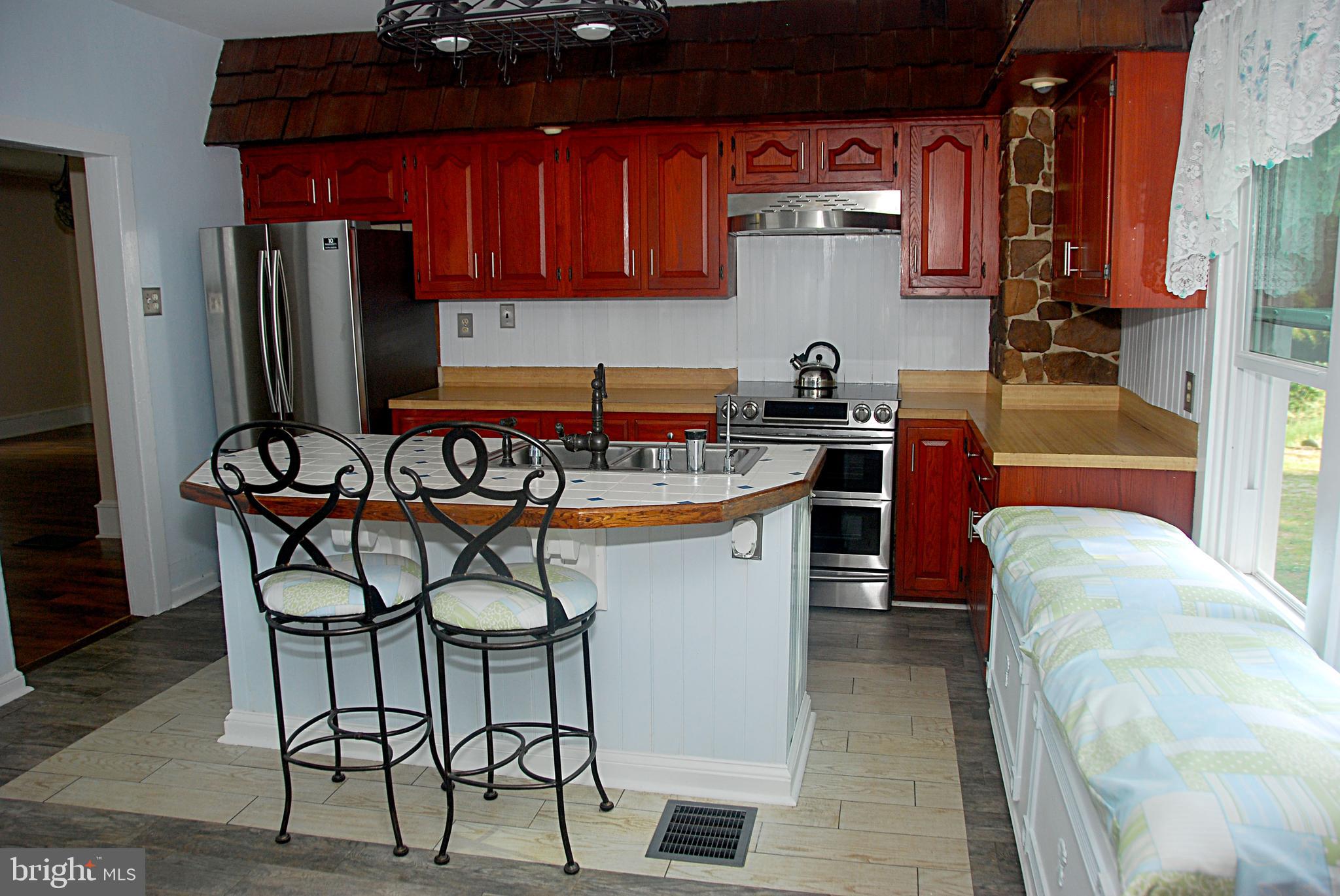 121 Chesterville Road Landenberg, PA 19350 - Photo 18 of 35 a kitchen with stainless steel appliances granite countertop a sink and cabinets