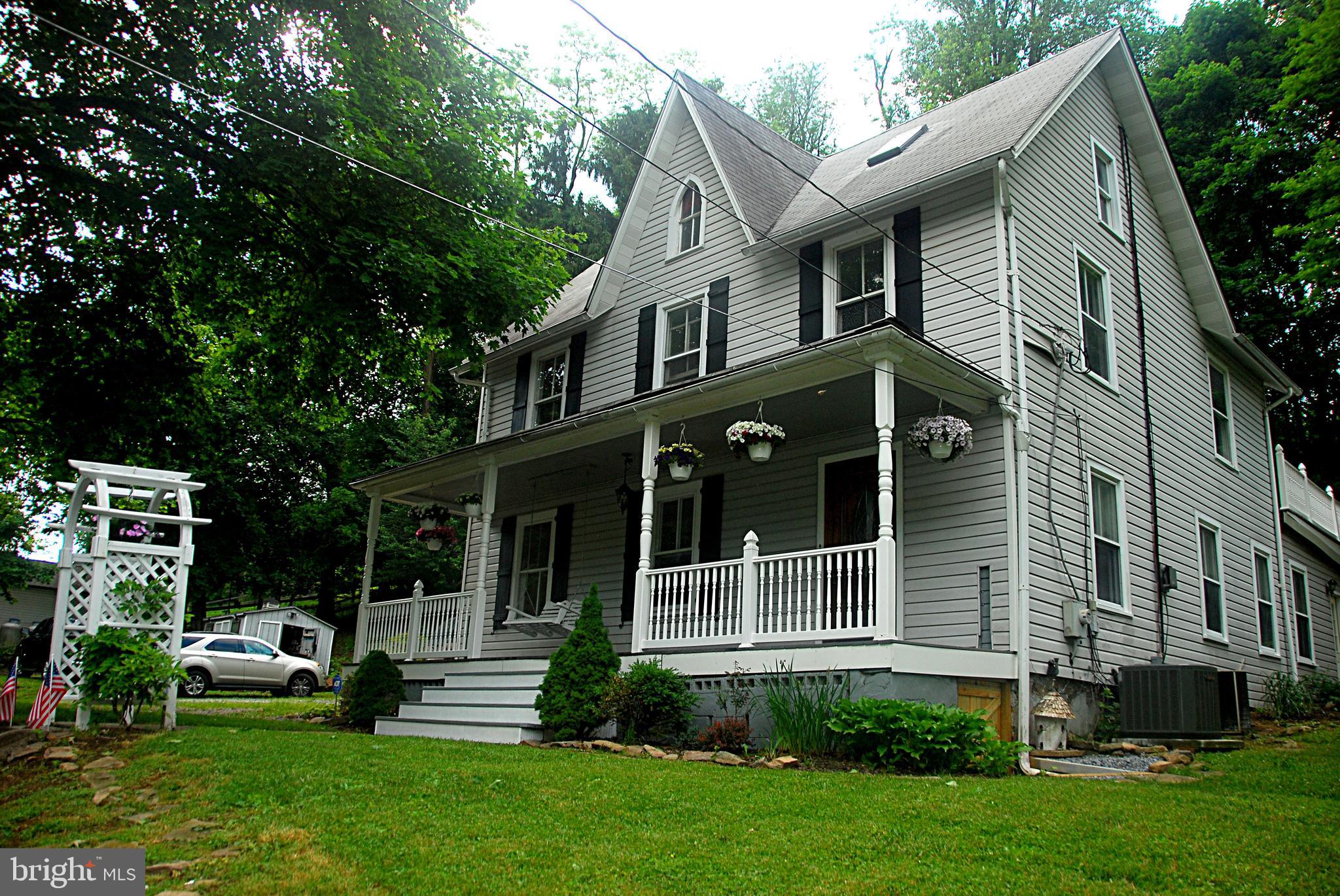 121 Chesterville Road Landenberg, PA 19350 - Photo 3 of 35 a front view of a house with a garden and plants