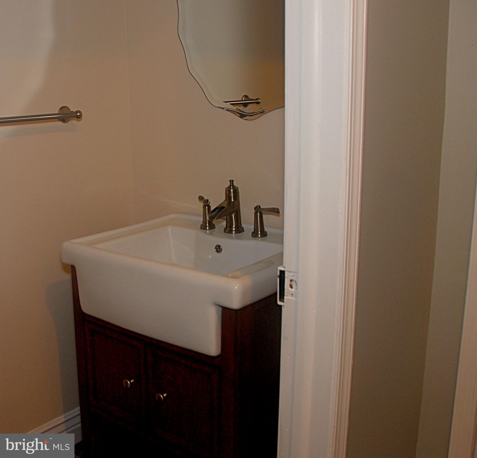 121 Chesterville Road Landenberg, PA 19350 - Photo 23 of 35 a bathroom with a sink and a mirror