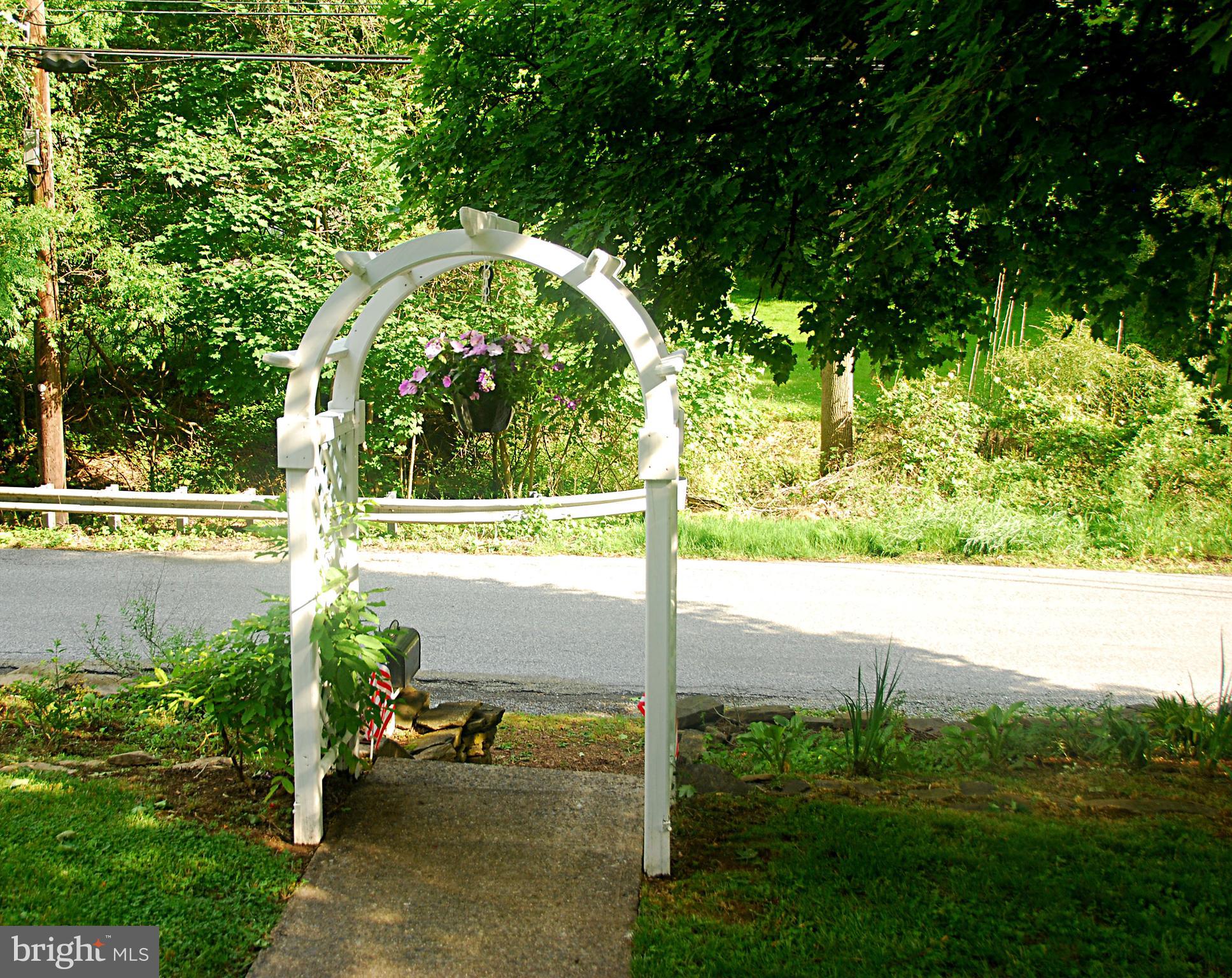 121 Chesterville Road Landenberg, PA 19350 - Photo 6 of 35 a view of a bench in the garden