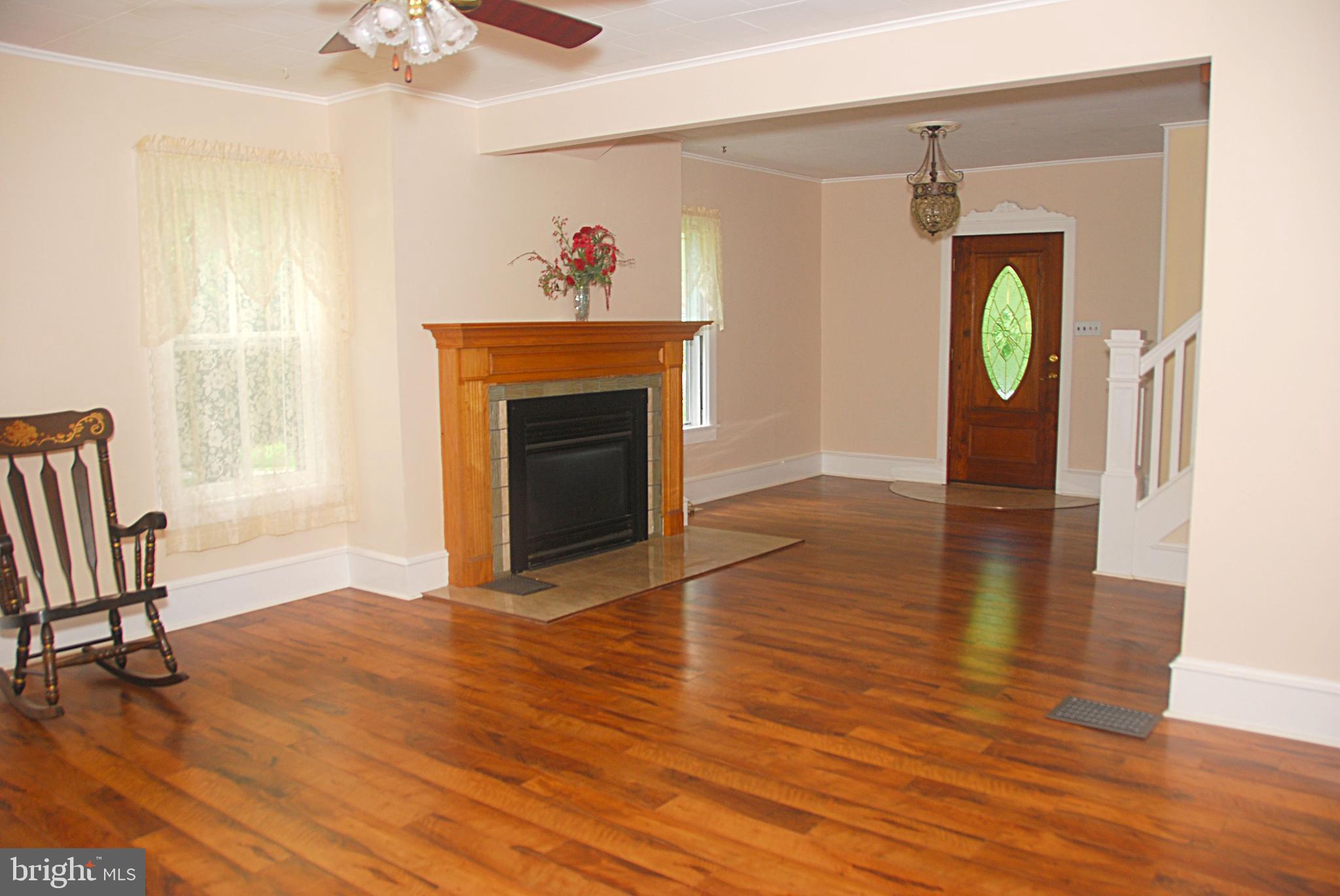 121 Chesterville Road Landenberg, PA 19350 - Photo 10 of 35 a view of an empty room with window and wooden floor