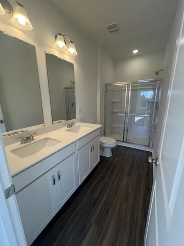 a view of building along with street and trees